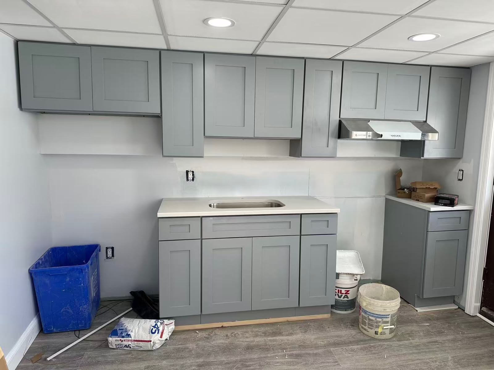 Grey Shaker cabinets and quartz counter installed on site with the backsplash still to go in
