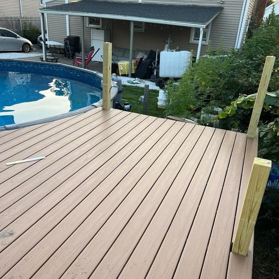 finished composite pool deck with posts ready for railings