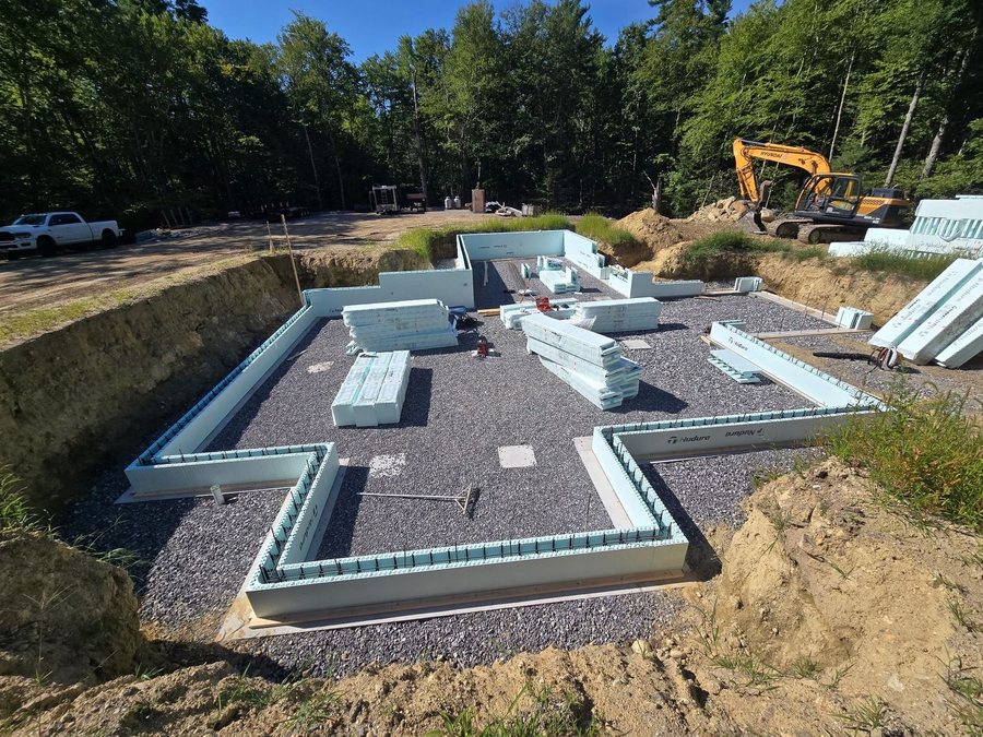 First course of insulated concrete form blocks set on the footing of a new house